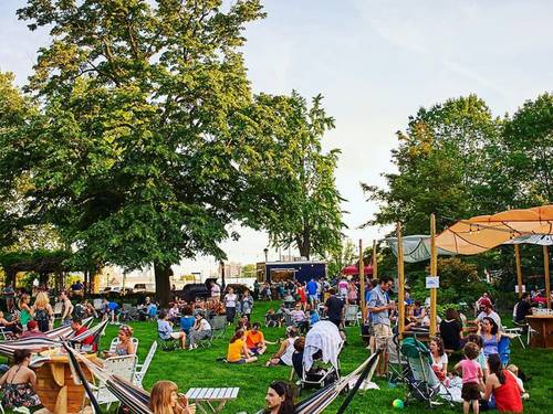 People spread across a park lawn