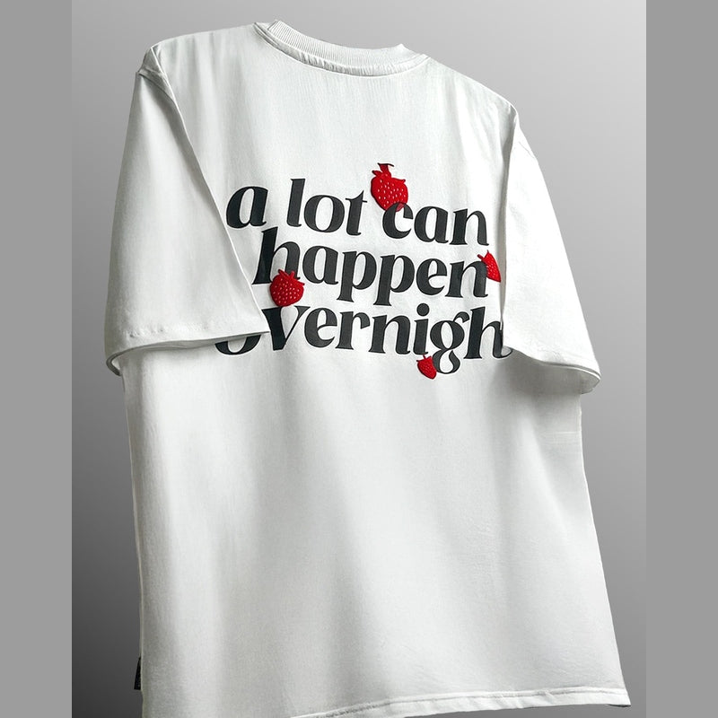 A LOT CAN HAPPEN OVERNIGHT HEAVYWEIGHT T-SHIRT
