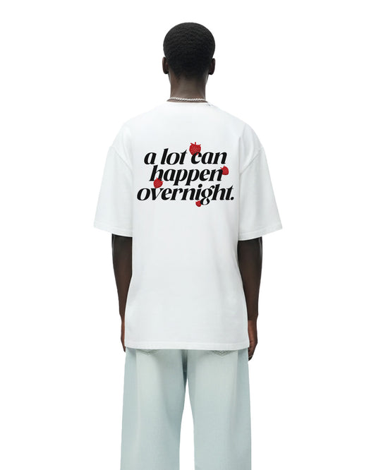 A LOT CAN HAPPEN OVERNIGHT HEAVYWEIGHT T-SHIRT